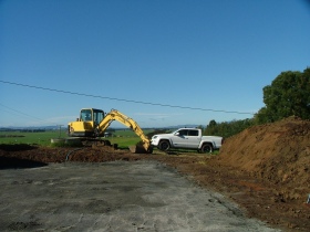 Photo of a digger used by Urlich Plumbing Ltd.